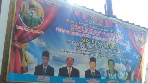 Spanduk King of The King dengan lembaga IMD di Kutai Timur. (Istimewa)