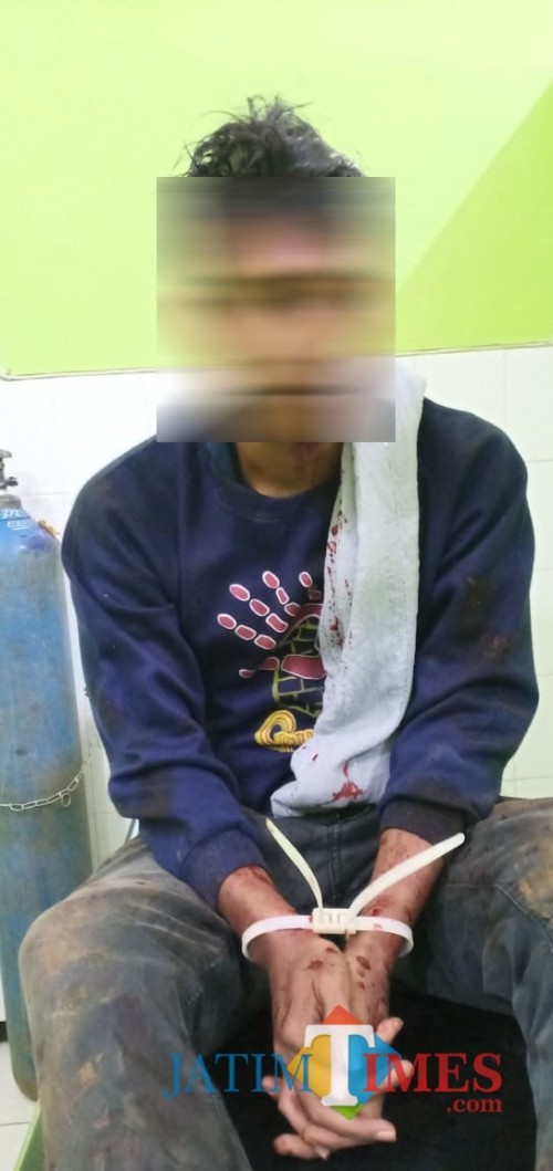 Tersangka Nanang Qosim sesaat setelah diringkus polisi (Foto : Polsek Donomulyo for MalangTIMES)