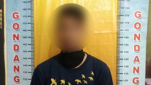 Dony Pratama S tersangka kasus penganiayaan terhadap remaja putri berkebutuhan khusus saat diamankan polisi (Foto : Polsek Gondanglegi for MalangTIMES)