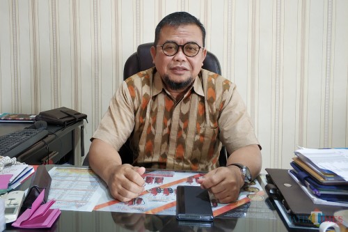 Ketua Kadin Kota Kediri H. Muhammad Solikhin ketika ditemui di kantornya. (Foto: B. Setioko/ JatimTIMES)