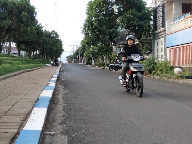 Jalan di Perumahan Joyogrand yang menjadi akses utama menuju Perumahan Graha Agung.(Foto: Ilustrasi/Riski Wijaya/MalangTIMES).