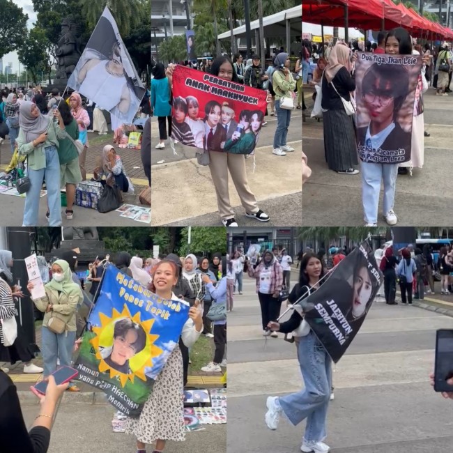 Tampak beberapa NCTzen memamerkan banner hand yang dibawanya saat konser NCT 127. (Foto: Fitriana Dwi Andarsari)