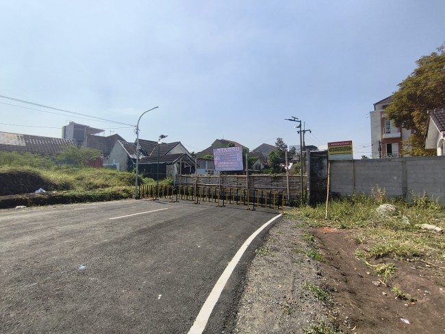 Kondisi jalan tembus Jalan Simpang Candi Panggung yang sudah diaspal.(Foto: Riski Wijaya/MalangTIMES).